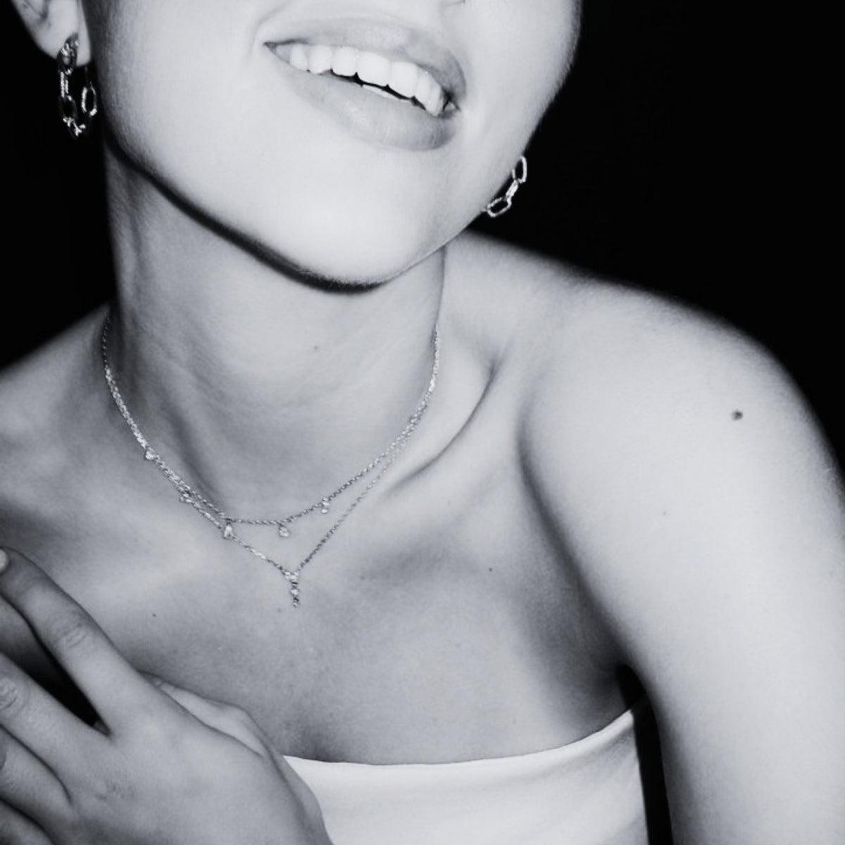 Woman wearing delicate jewellery